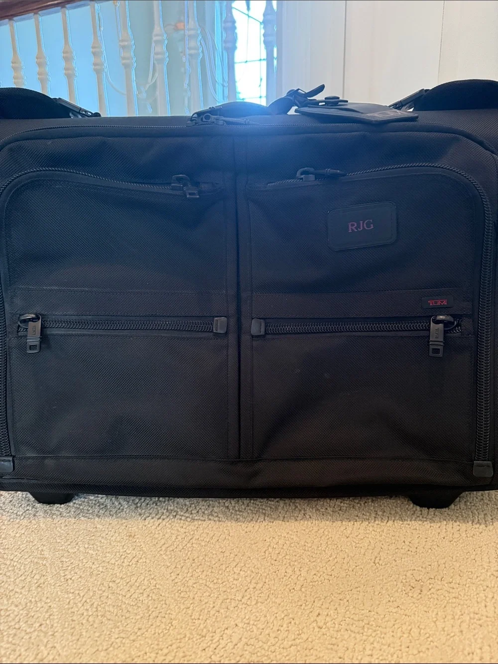 Tumi Black Fold-Open Garment Bag with Multiple Zip Pockets